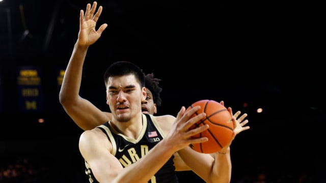 Purdue Boilermakers center Zach Edey (15) grabs the rebound over Michigan Wolverines forward Tarris Reed Jr. (32) in the second half at Crisler Center in Ann Arbor, Michigan, on Feb. 25, 2024.
